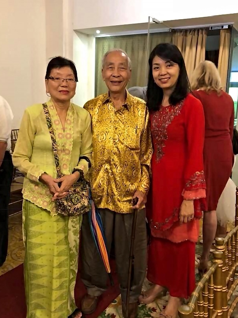 Angela (right) with her late parents, who ran Shanghai Tailors