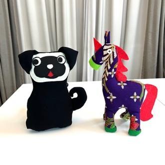 Unicorn and horse soft toys stitched by students